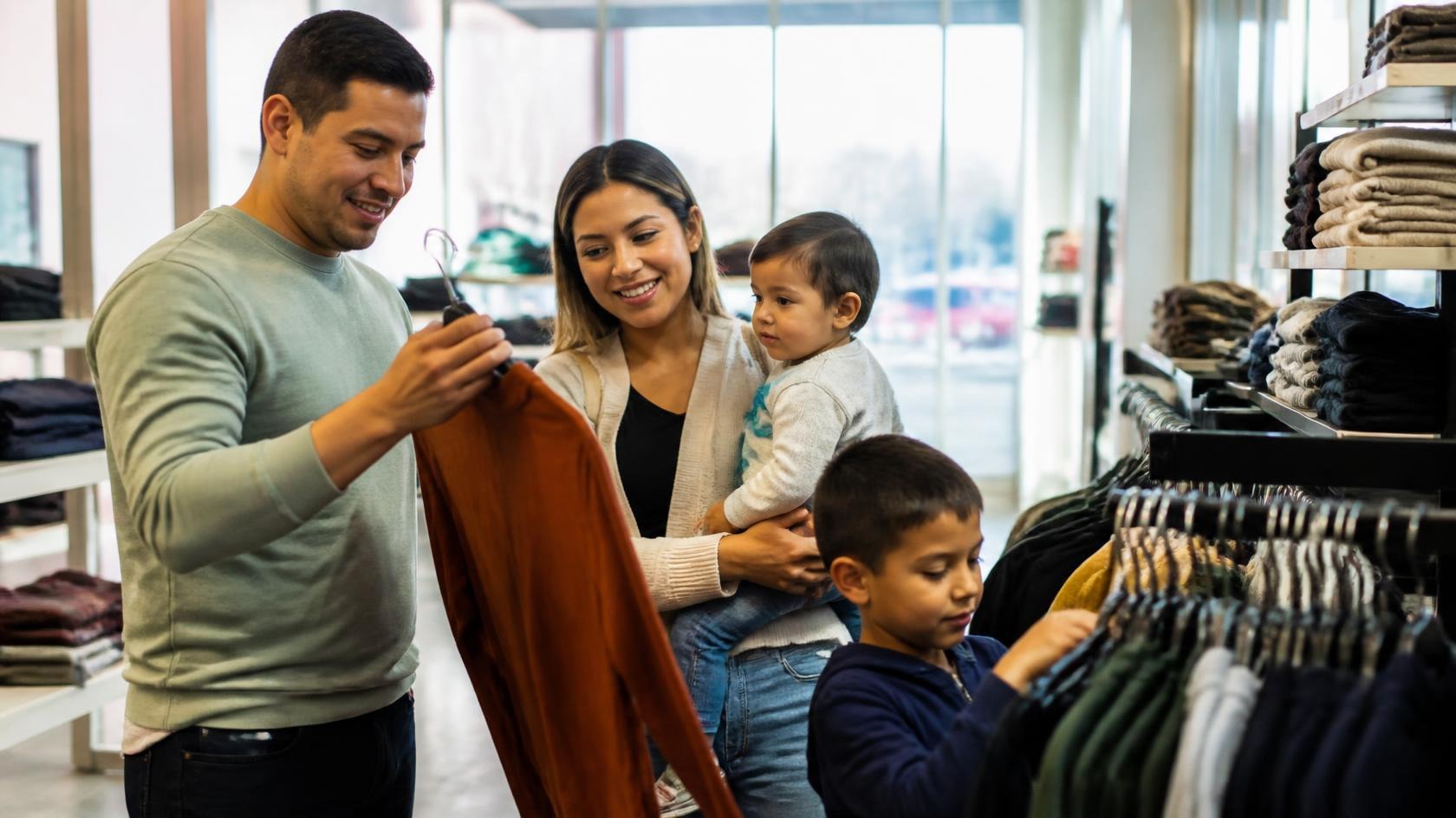 Hispanic Latino consumers shopping at American storefront