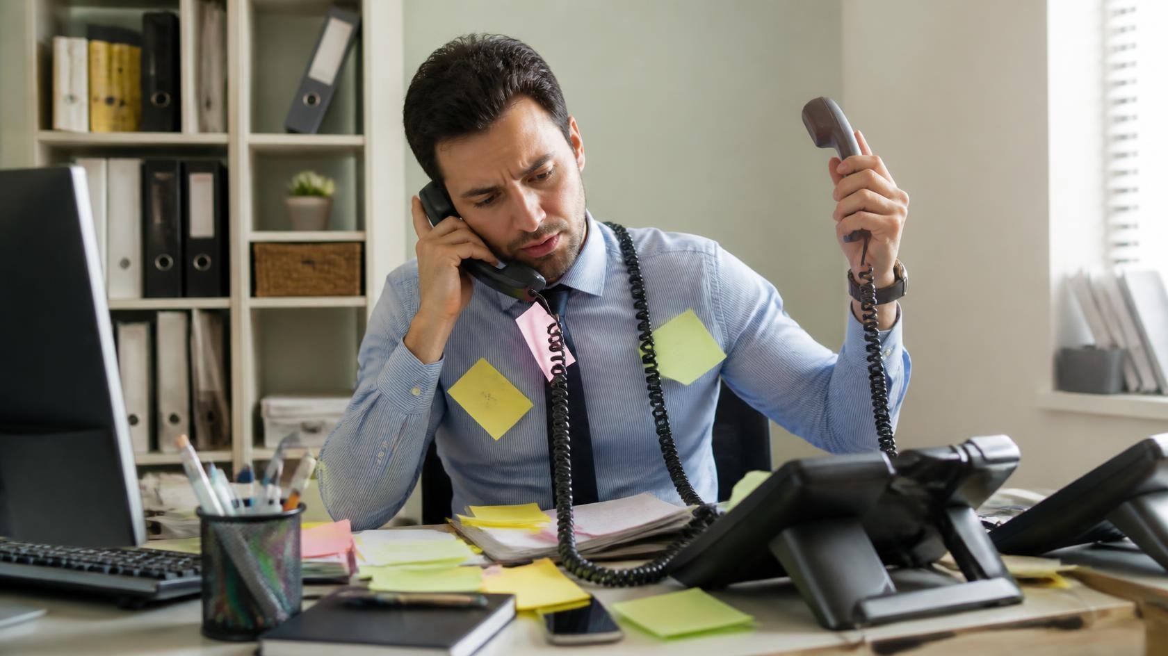 Single employee overwhelmed covering phones alone